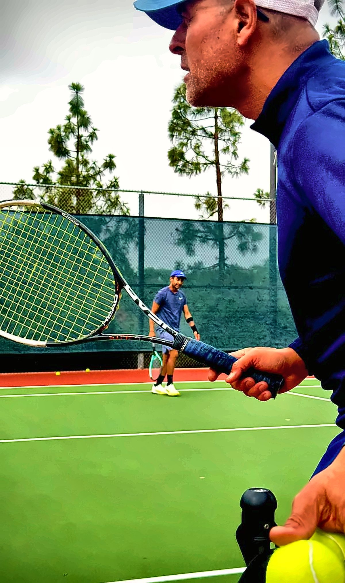 Fawz feeding a ball to a student