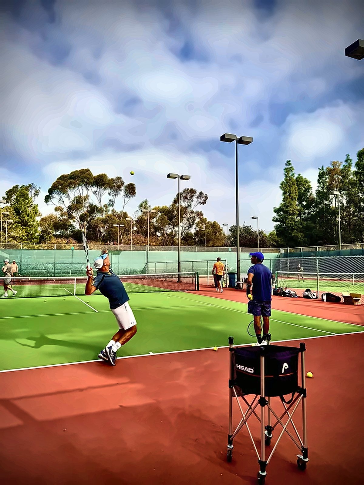 Two players on court during a semi-private lesson