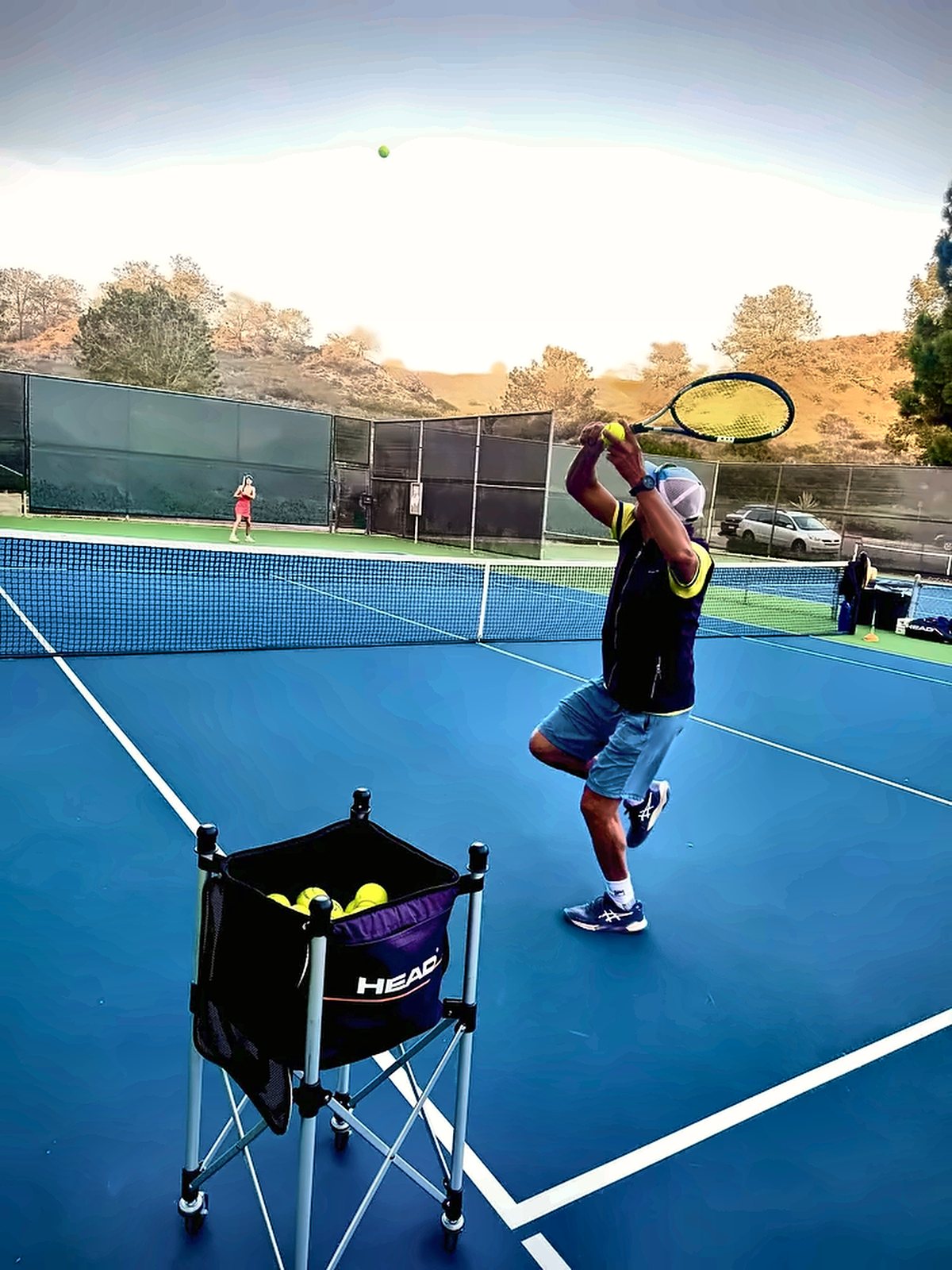 Player in the trophy position before a serve